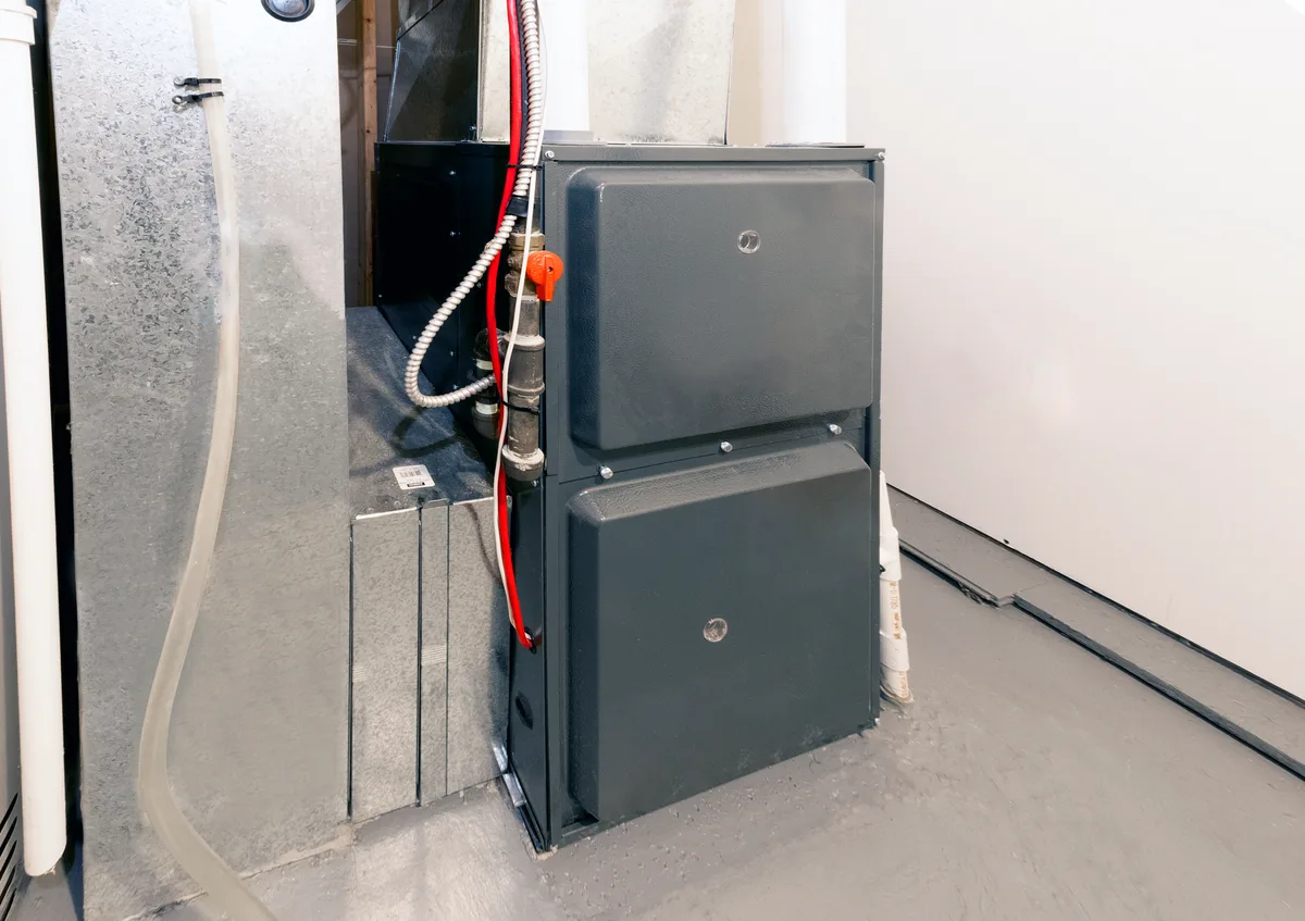 High-efficiency furnace newly installed in a residential basement