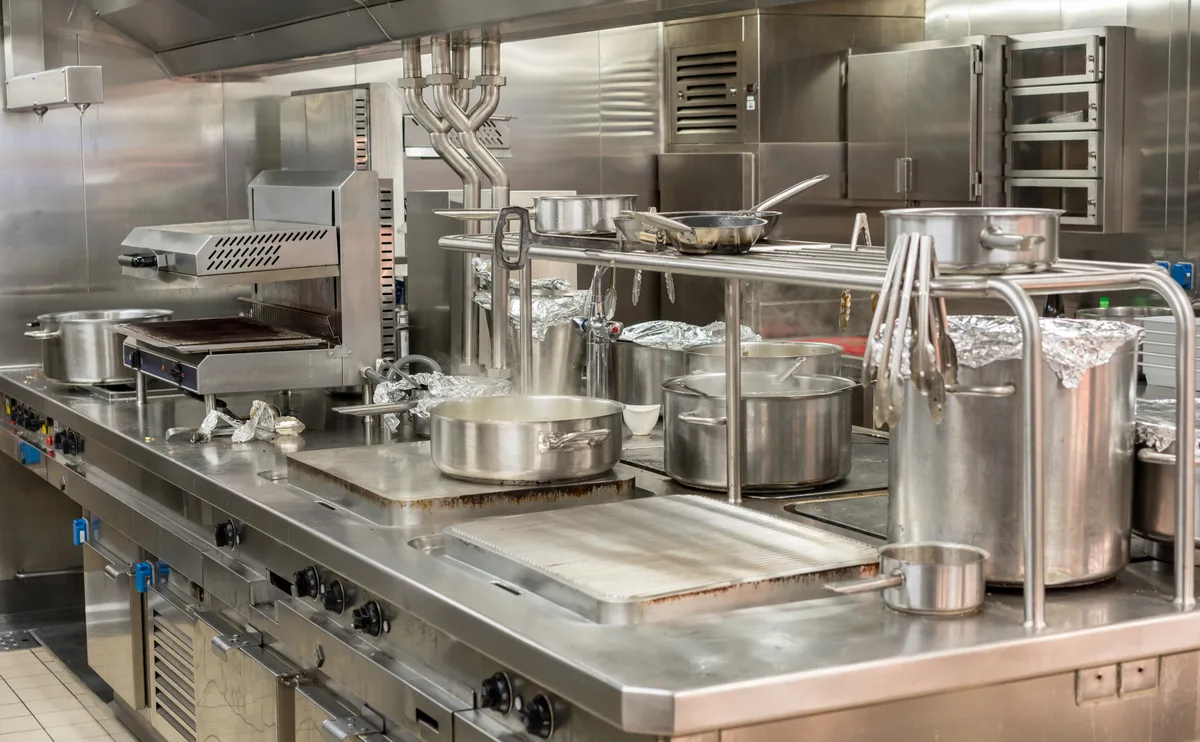 Stainless steel cooking line in a commercial kitchen