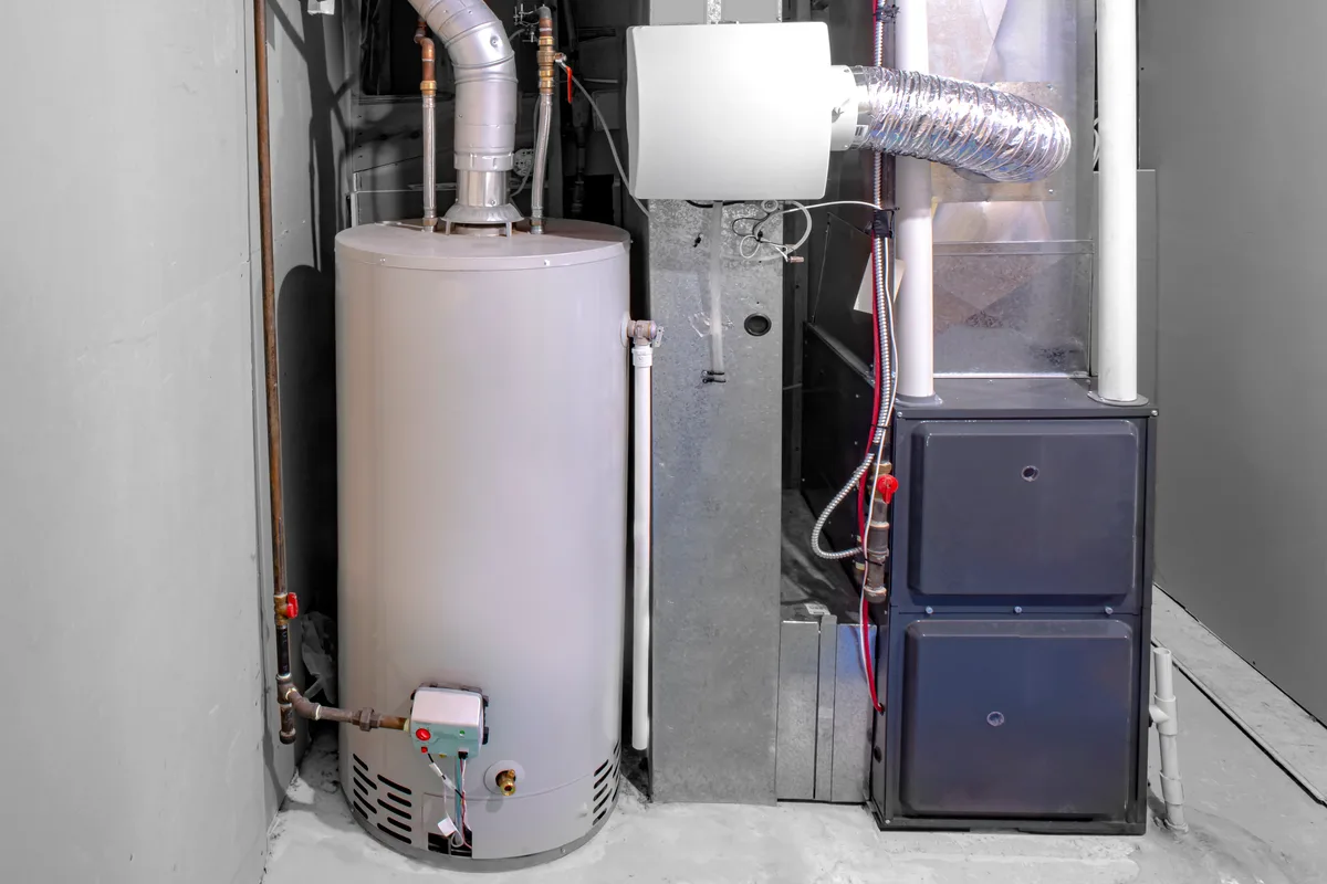 High-efficiency furnace beside a gas water heater and humidifier